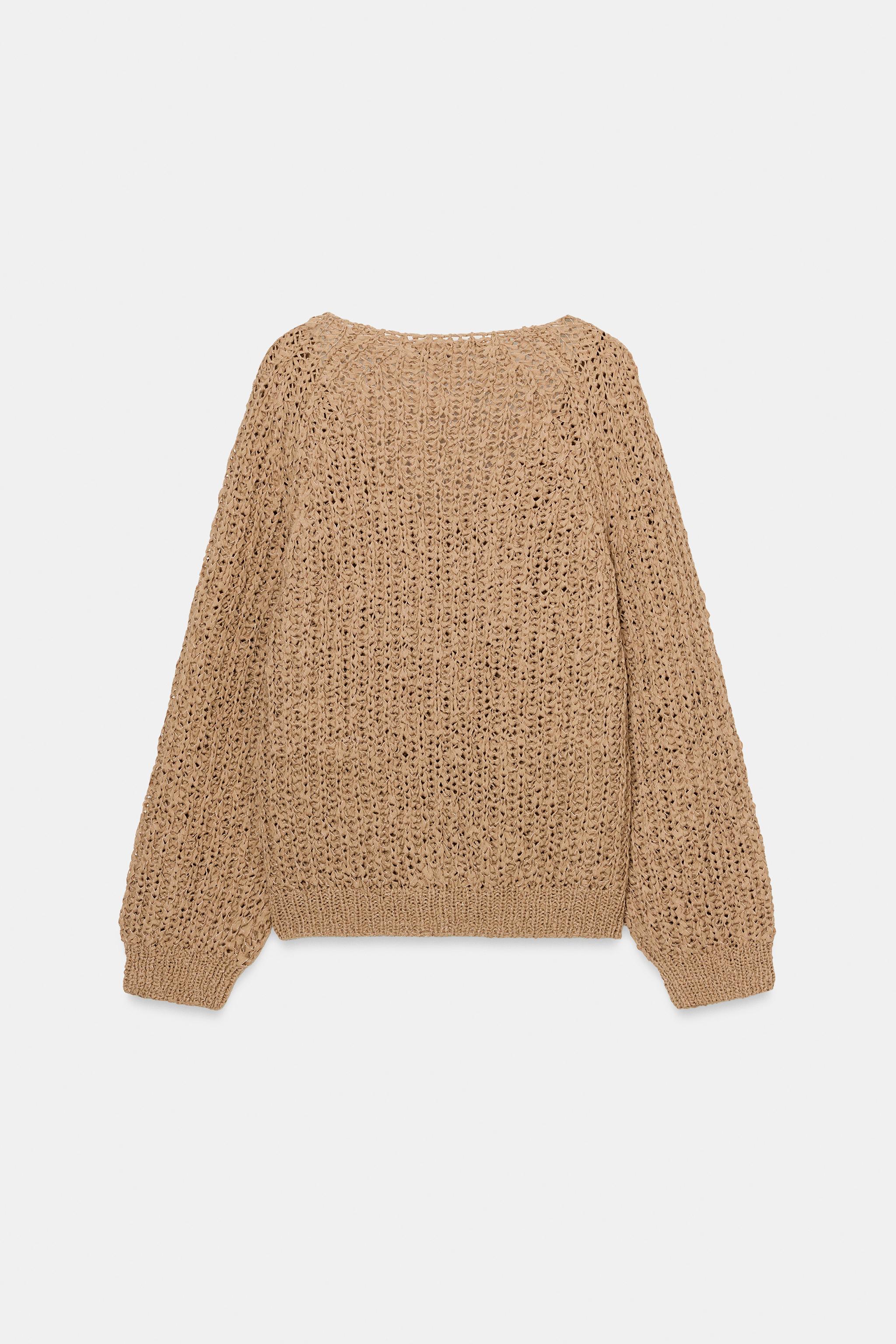 PULL EN MAILLE AVEC BANDE ENTRELACÉE